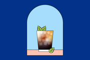 Illustration of the mint chocolate coffee mojito in a short glass with ice cubes and mint.